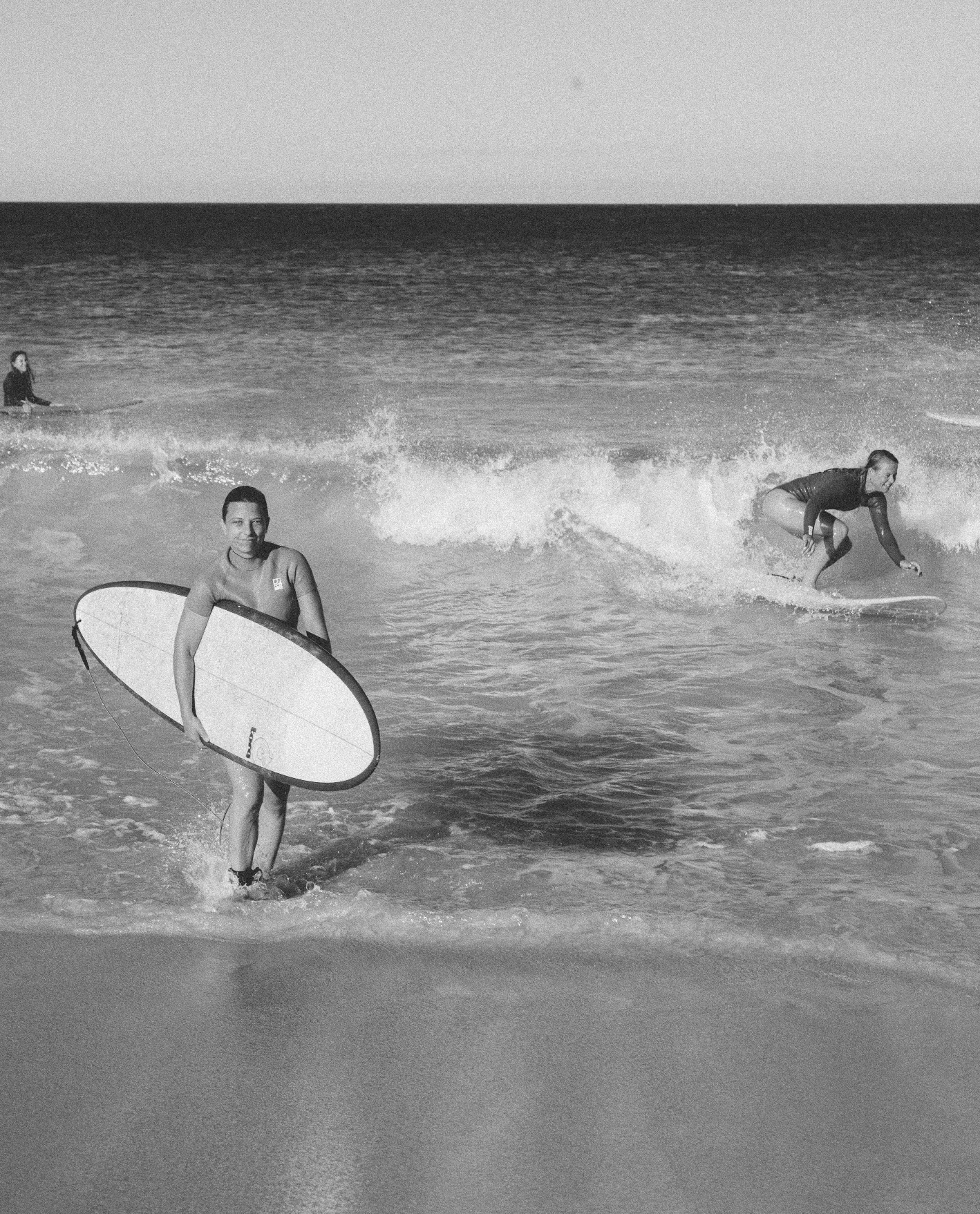 Surfer wearing Nisi sustainable surfwear